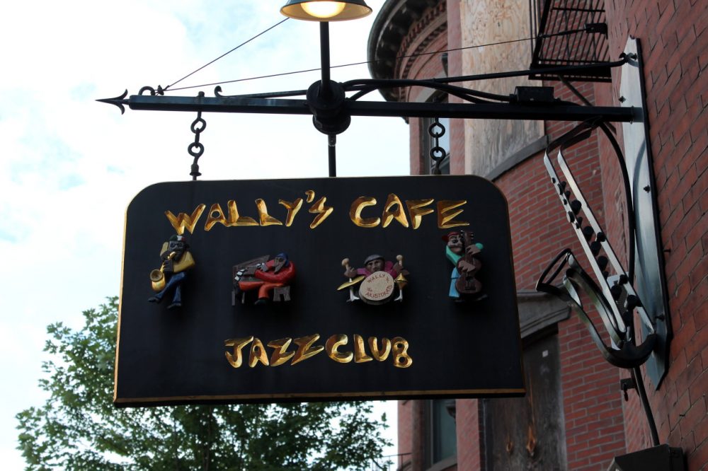 The sign outside of Wally's Cafe on Mass. Ave., discreetly curved into the shape of a saxophone. (Amy Gorel/WBUR)