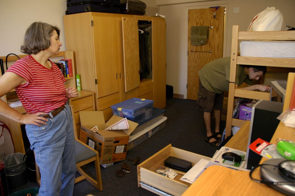 June Banker helps her son, Michael, move into his dorm room at Colgate University in Hamilton, N.Y., Thursday, Aug. 25, 2005. (Kevin Rivoli/AP)