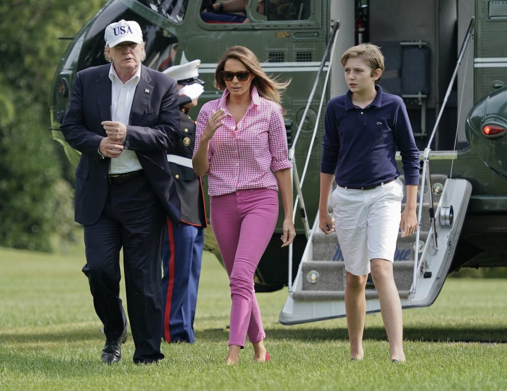 President Trump, First Lady Melania Trump and their son Barron Trump, 11, walk across the South Lawn of the White House in Washington on Sunday, following their return after spending the weekend at nearby Camp David, Md. (Pablo Martinez Monsivais/AP)