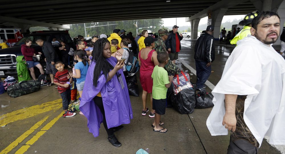 Evacuees waits to be bused to safety after being evacuated from their homEvacuees waits to be bused to safety after being evacuated from their homes as floodwaters from Tropical Storm Harvey rise on Monday in Houston. (David J. Phillip/AP)es as floodwaters from Tropical Storm Harvey rise on Monday in Houston. (David J. Phillip/AP)