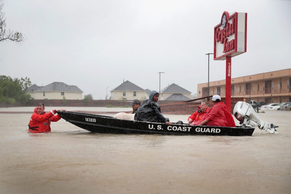 People are rescued from a flooded neighborhood after it was inundated with rain water, remnants of Hurricane Harvey, on Aug. 28, 2017 in Houston, Texas. (Scott Olson/Getty Images)