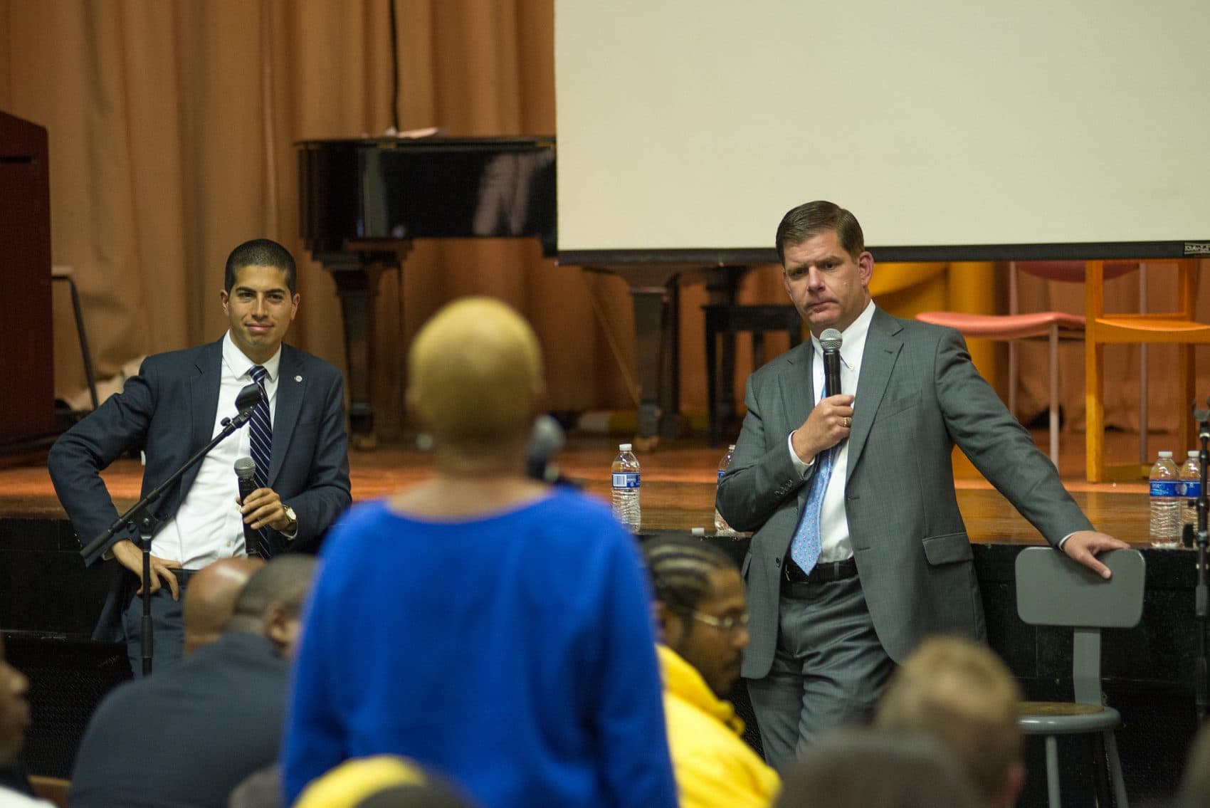 Dan Koh, then chief of staff to Boston Mayor Marty Walsh, and Walsh address Roxbury residents on May 20, 2014. (Courtesy Jeremiah Robinson/Mayor's Office)