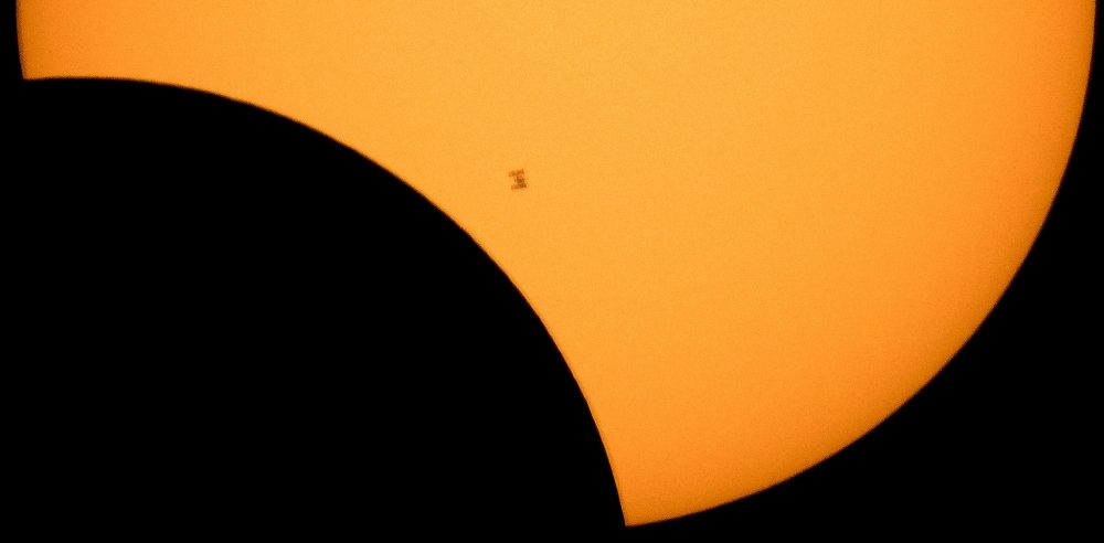 The International Space Station is seen as it transits the sun during the solar eclipse. (NASA)