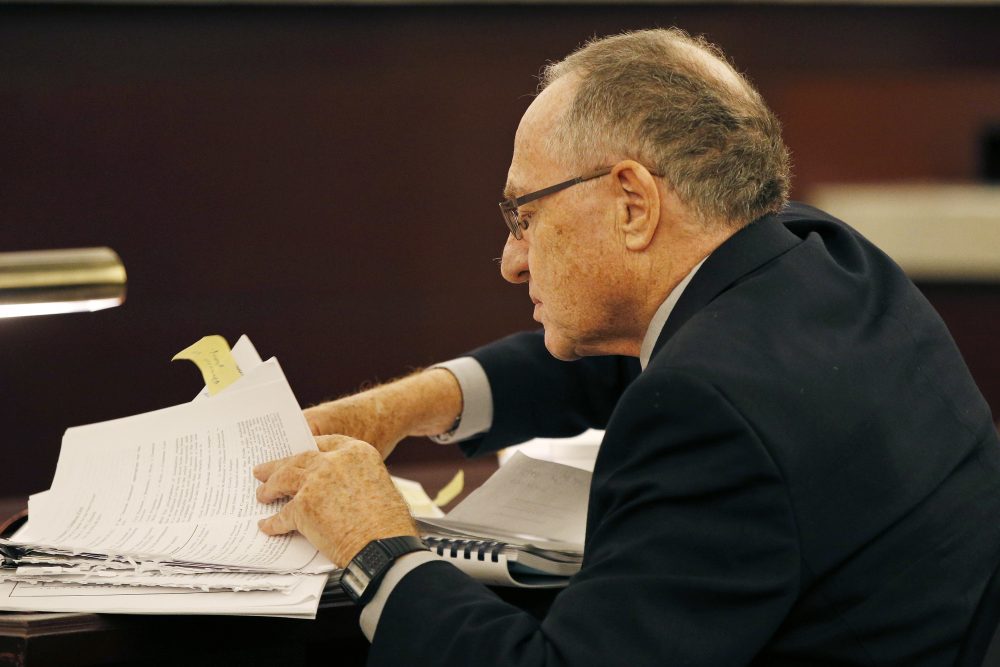 Attorney Alan Dershowitz looks through papers during a session of the Nevada Supreme Court, Tuesday, April 5, 2016, in Las Vegas. (AP Photo/John Locher)