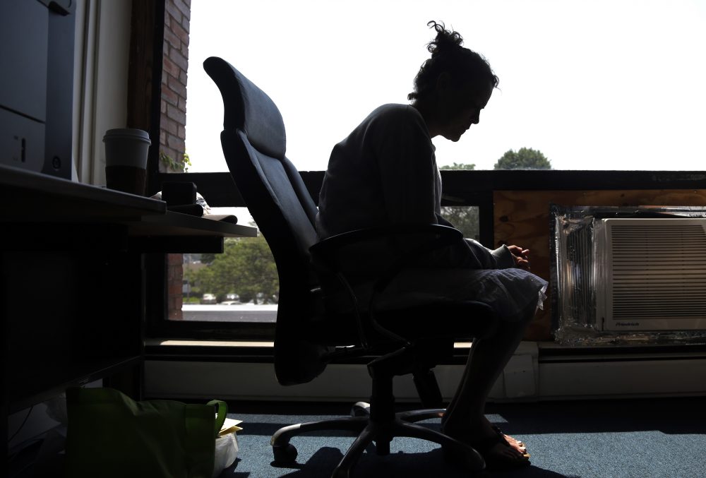In this July 10, 2015 photo, a woman who voluntarily came for help to kick her heroin addiction speaks to The Associated Press inside the police station in Gloucester, Mass. The novel drug addiction program was developed in the small fishing town and replicated in dozens of cities nationwide. (Elise Amendola/AP)