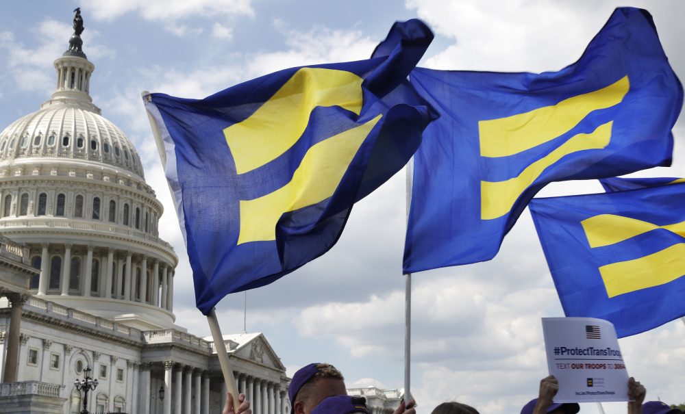 People with the Human Rights Campaign hold up &quot;equality flags&quot; during an event organized by Rep. Joe Kennedy, D-Mass., in support of transgender members of the military, Wednesday, July 26, 2017, on Capitol Hill in Washington, after President Donald Trump said he wants transgender people barred from serving in the U.S. military &quot;in any capacity,&quot; citing &quot;tremendous medical costs and disruption.&quot; (Jacquelyn Martin/ AP)