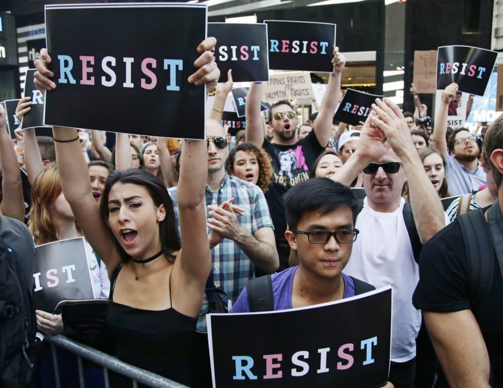 Protesters react as New York City Public Advocate Letitia James speaks during a rally in Times Square on July 26. The rally was held in protest of President Trump's announcement of a ban on transgender troops serving anywhere in the U.S. military. (Frank Franklin II/AP)
