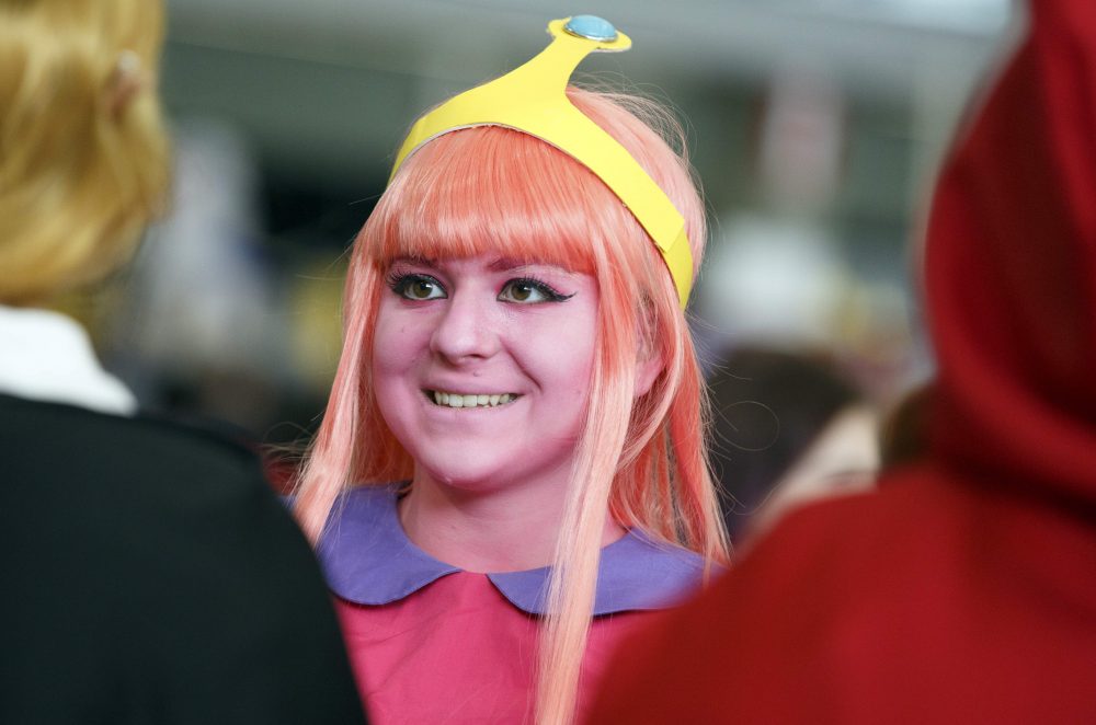 Samantha, no last name given, attends Boston Comic Con dressed as Princess Bubblegum, Friday, Aug. 11, 2017, in Boston. The convention is being held at the Boston Convention &amp; Exhibition Center through Sunday. (AP Photo/Michael Dwyer)