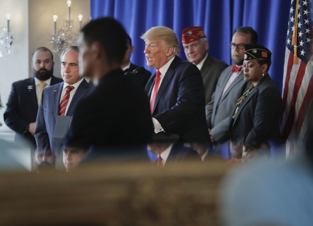 President Trump is seen reflected in a ballroom mirror while speaking to members of the media regarding the ongoing situation in Charlottesville Saturday at Trump National Golf Club in Bedminster, N.J. (Pablo Martinez Monsivais/AP)