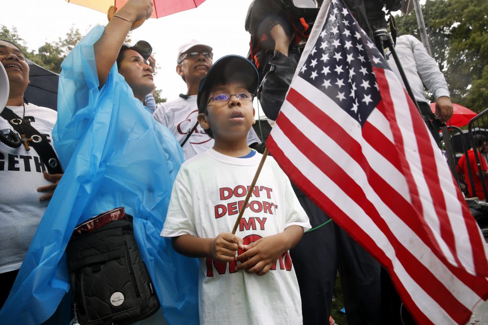 Michael Claros, 8, of Silver Spring, Md., attends a rally in favor of immigration reform, Tuesday, Aug. 15, 2017, at the White House in Washington. The eight-year old is a U.S. citizen whose parents would have been eligible for DAPA, or Deferred Action for Parents of Americans, an Obama era policy memo that the Trump administration has since formally revoked. (Jacquelyn Martin/AP)