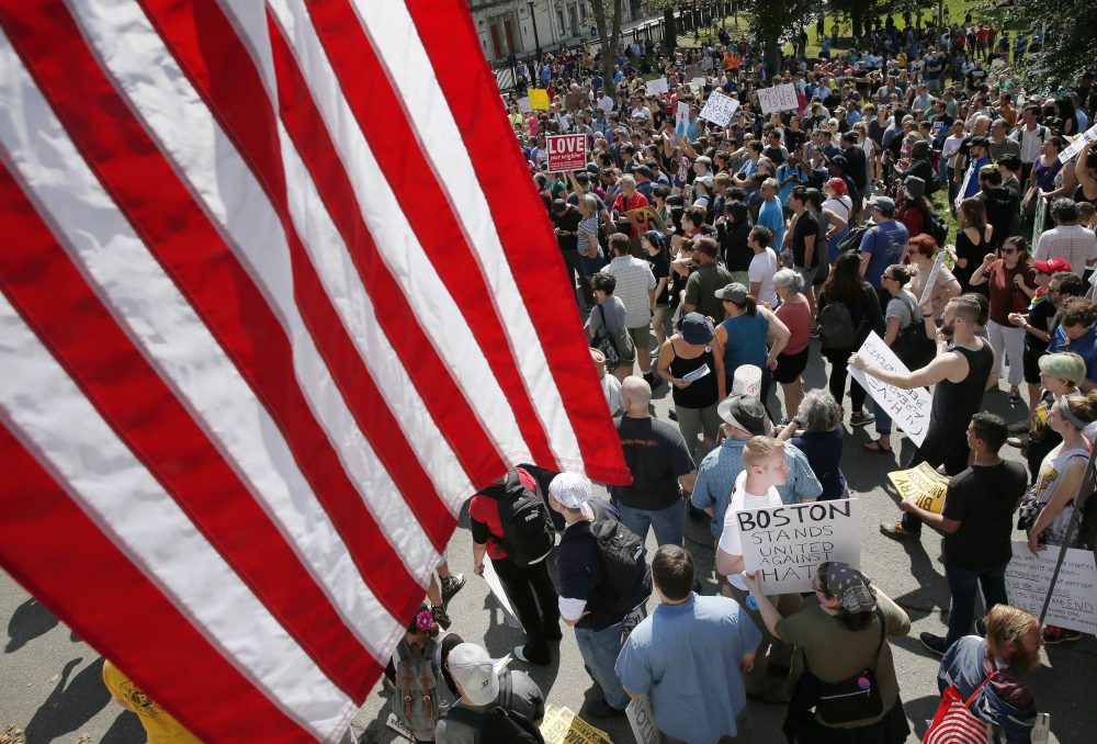 Counter-protesters assemble at the State House before a planned &quot;Free Speech&quot; rally by conservative organizers begins on the adjacent Boston Common on Saturday. (Michael Dwyer/AP)