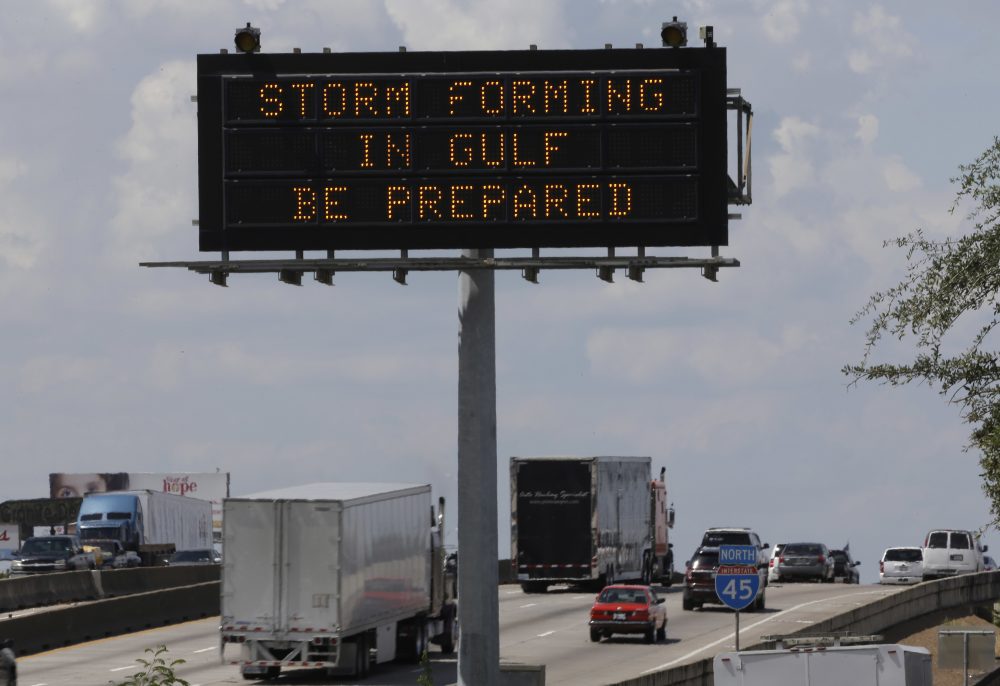 Motorists in Houston pass a sign warning of Hurricane Harvey as the storm intensifies in the Gulf of Mexico Thursday. (David J. Phillip/AP)