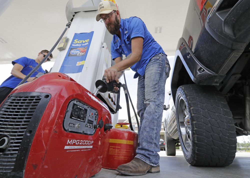 Aaron Berg fills up a gas can and his portable generator Thursday in Houston as Hurricane Harvey intensifies in the Gulf of Mexico. (David J. Phillip/AP)