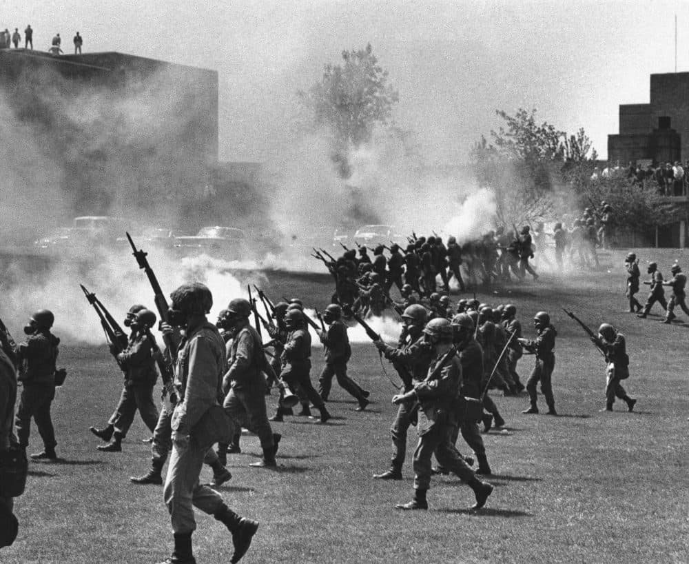 In a May 4, 1970 file photo, Ohio National Guard moves in on rioting students at Kent State University in Kent, Ohio. Four persons were killed and eleven wounded when National Guardsmen opened fire. (AP)