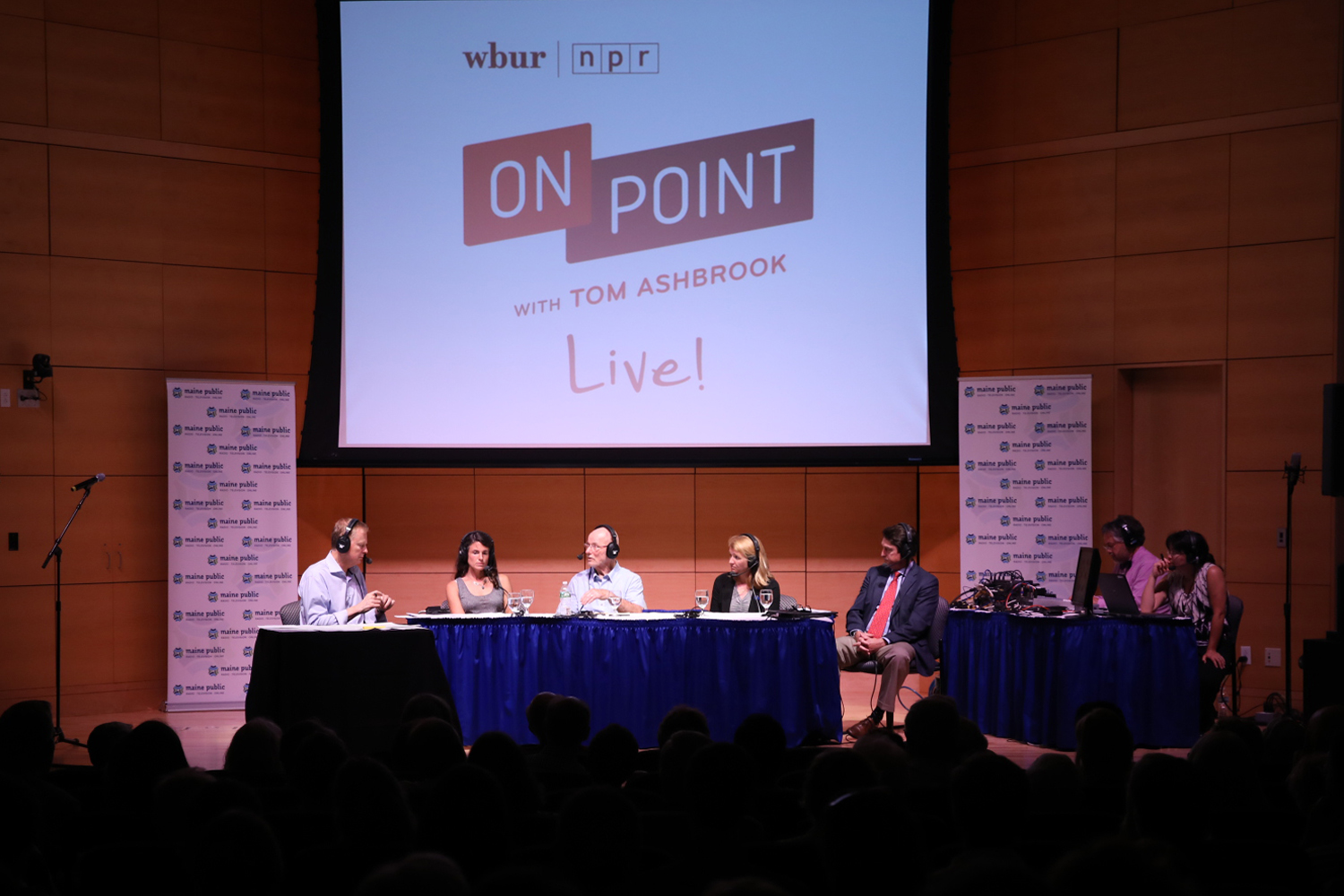 Tom Ashbrook moderates a discussion at the #OnPointLive show in Portland, Maine. (Brian Bechard/Maine Public)