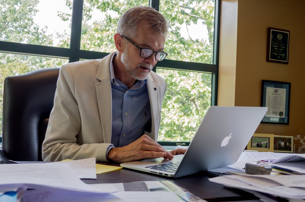 Wheelock College President David Chard in his office. (Max Larkin/WBUR)