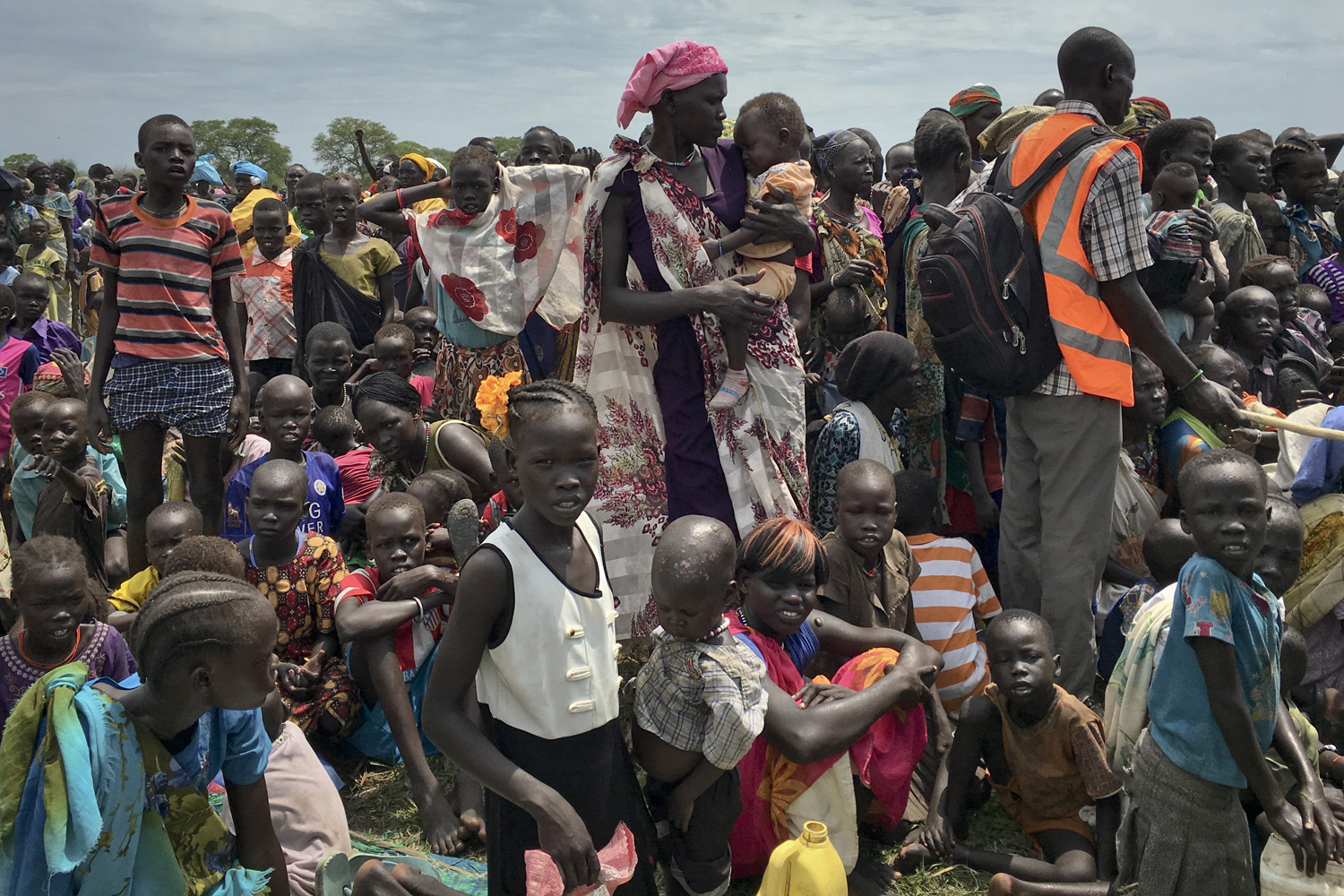 Men, women and children line up to be registered with the World Food Programme in South Sudan. South Sudan no longer has areas in famine, but almost 2 million people are on the brink of starvation. (Sam Mednick/AP)