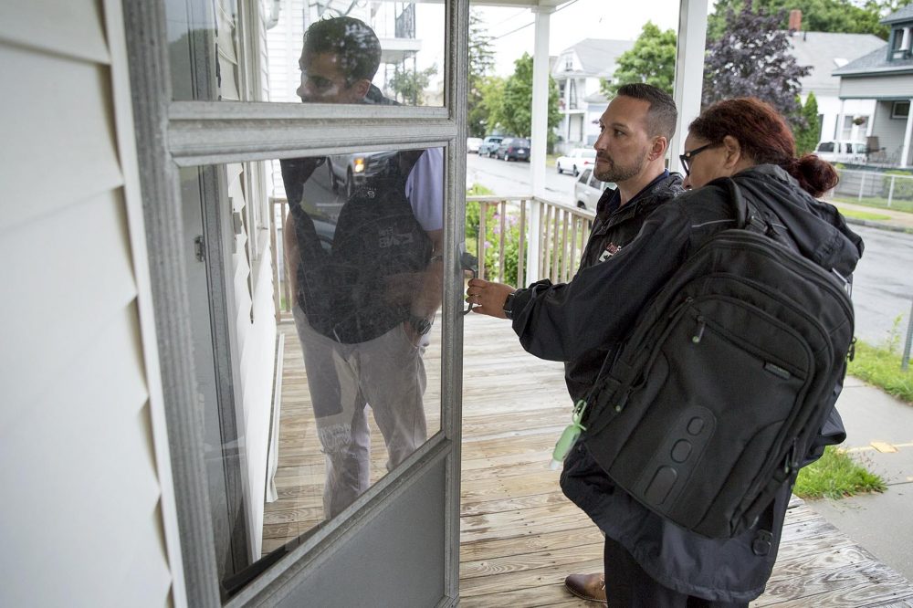 The outreach team knocks on a door in New Bedford. On this call they find the person they're looking for is no longer living at this address. (Robin Lubbock/WBUR)