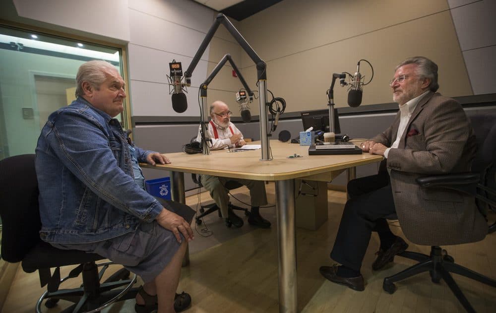 Bob Oakes, center, speaks to Bobby Dellelo, left, and former DOC Deputy Commissioner Dave Haley in the WBUR studios. Dellelo spent 40 years in prison -- more than five of them in solitary confinement. (Jesse Costa/WBUR)