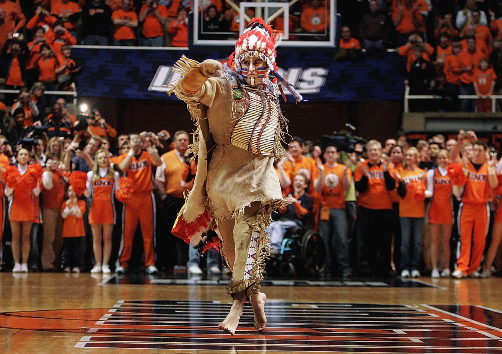 In this Feb. 21, 2007 file photo, University of Illinois mascot Chief Illiniwek performs for the last time during an Illinois basketball game in Champaign, Ill. Illinois says the school is ending its tradition of playing "war chant" music during sporting events. (Seth Perlman/AP)