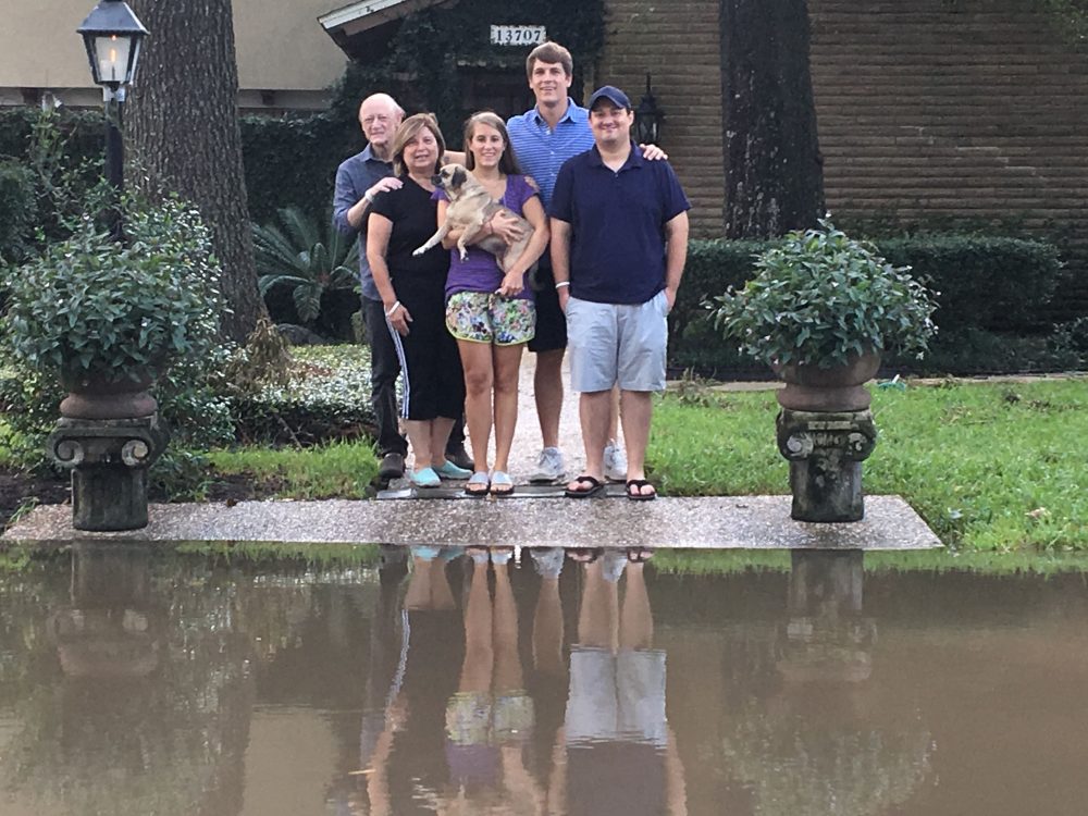 The Fallick family in front of their home. From left to right: Ed and Leticia Fallick, Carla Fallick and Zack Wilson (who were married two days ago) and Federico Fallick. (Anthony Brooks / WBUR) 