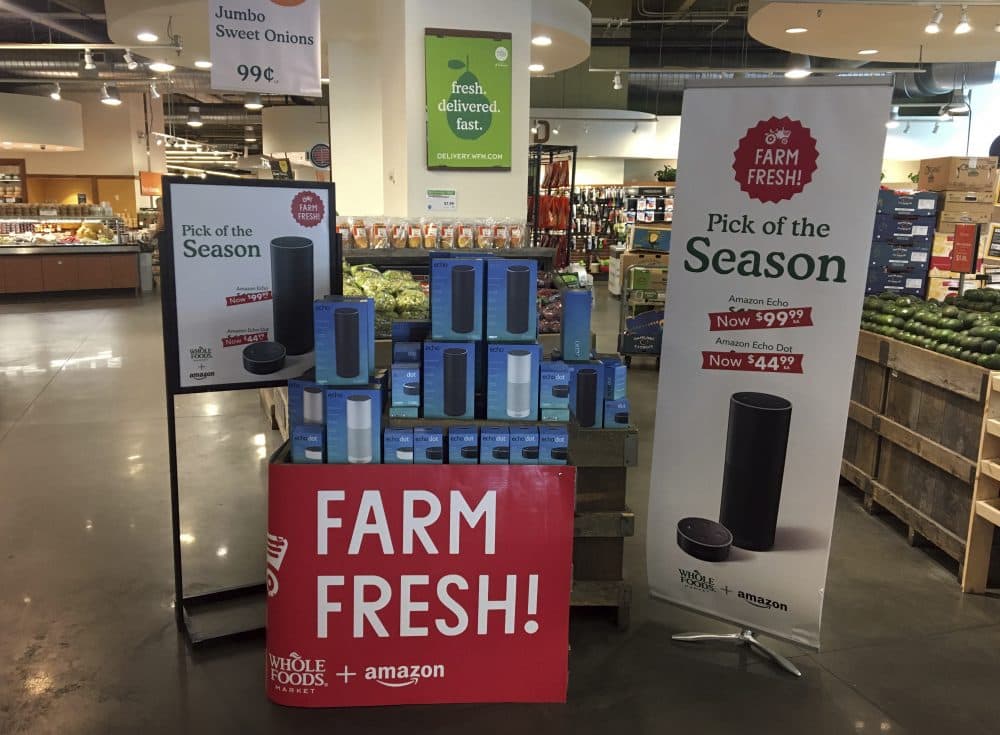 Amazon's Echo and Echo Dot appear on sale at a Whole Foods Market in New York, Monday, Aug. 28, 2017. Amazon has completed its $13.7 billion takeover of organic grocer Whole Foods, and the e-commerce giant is wasting no time putting its stamp on the company. (Joseph Pisani/AP)