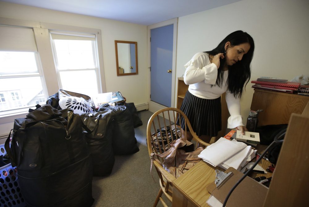 Love unpacks in her dorm room at the women's school. (Steven Senne/AP)