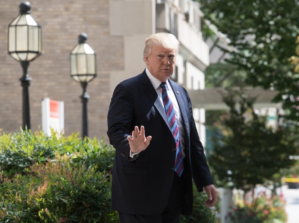 President Trump waves to the press as he walks out of St. John's Epicopal Church in Washington, D.C., on Sept. 3, 2017 after attending a service on the National Day of Prayer for victims of Hurricane Harvey he proclaimed earlier this week. (Nicholas Kamm/AFP/Getty Images)
