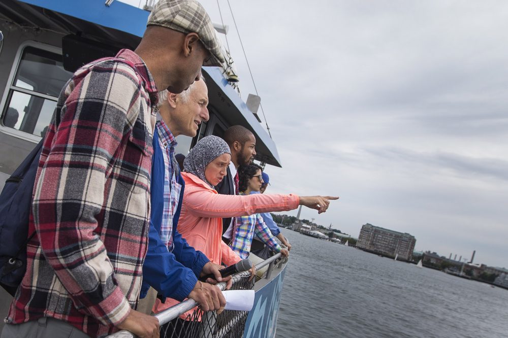 Ayed, center, speaks to a group of climate advocates during a boat tour of Boston Harbor. (Jesse Costa/WBUR)