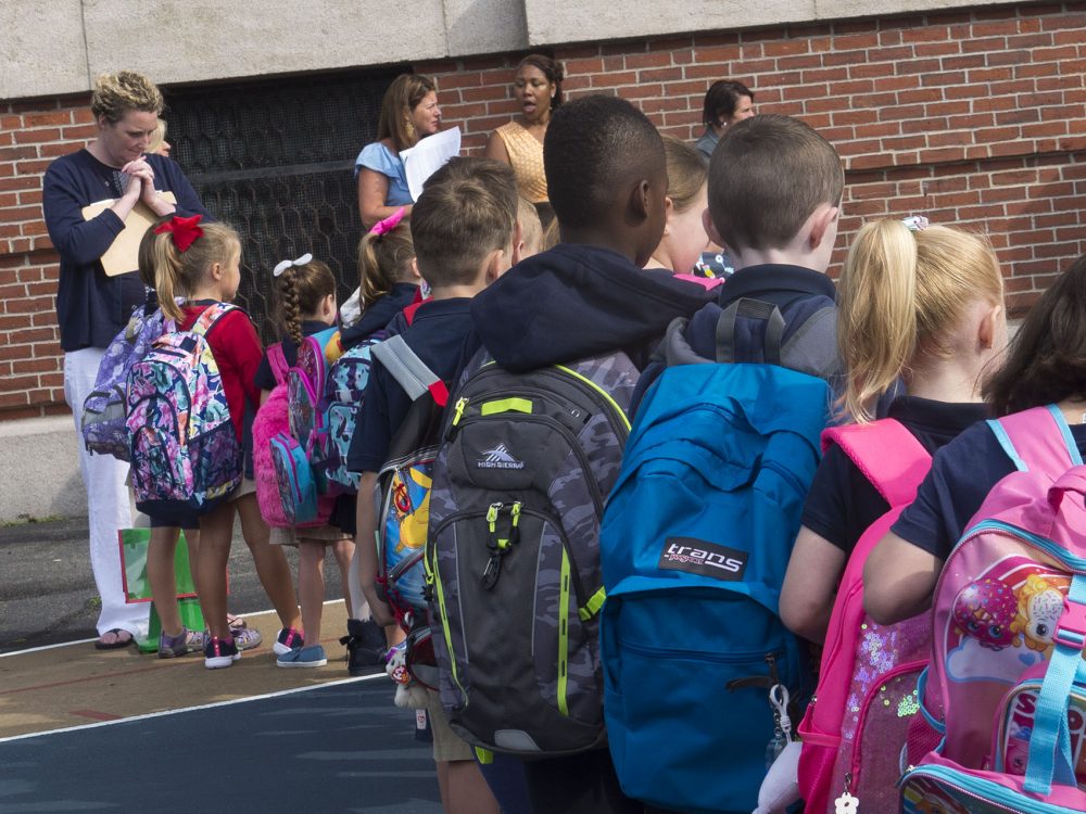 Students line up for the first day of school at Oliver Hazard Perry School in South Boston. (Max Larkin/WBUR)