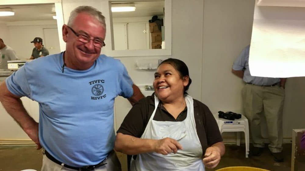 Harry Phillips with master picker Elpidia Martinez, one of 600 Mexican seasonal migrant workers, mostly women, who get H-2B visas to work in Maryland. The state’s seafood industry says each worker supports 2.5 American jobs. (Armando Trull/WAMU)