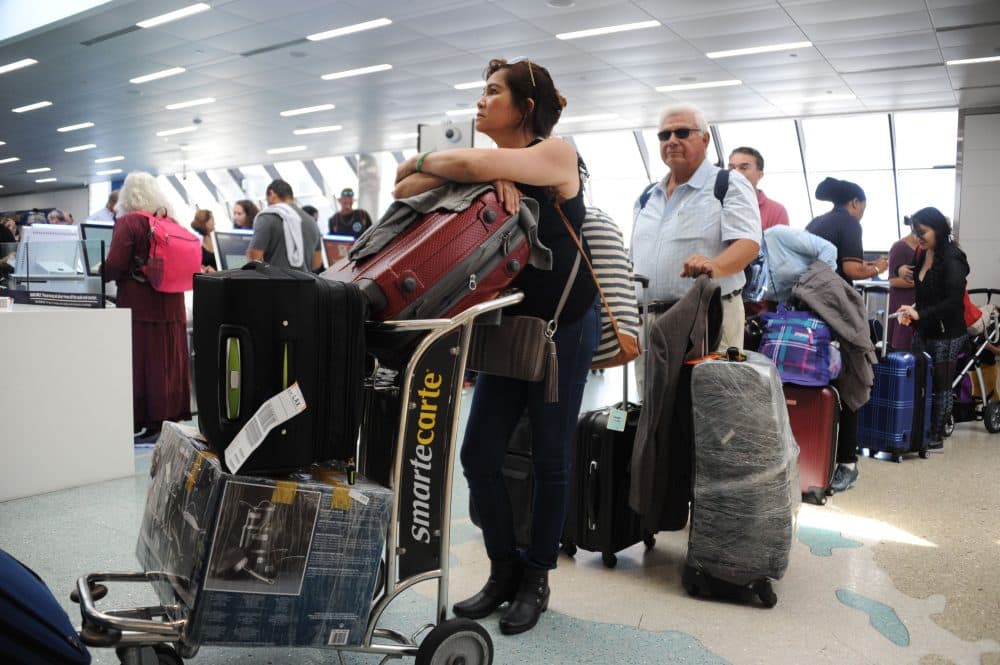 People crowd Fort Lauderdale International Airport as evacuation is underway for the arrival of Hurricane Irma, Sept. 7, 2017 in Fort Lauderdale, Fla. (Michele Eve Sandberg/AFP/Getty Images)