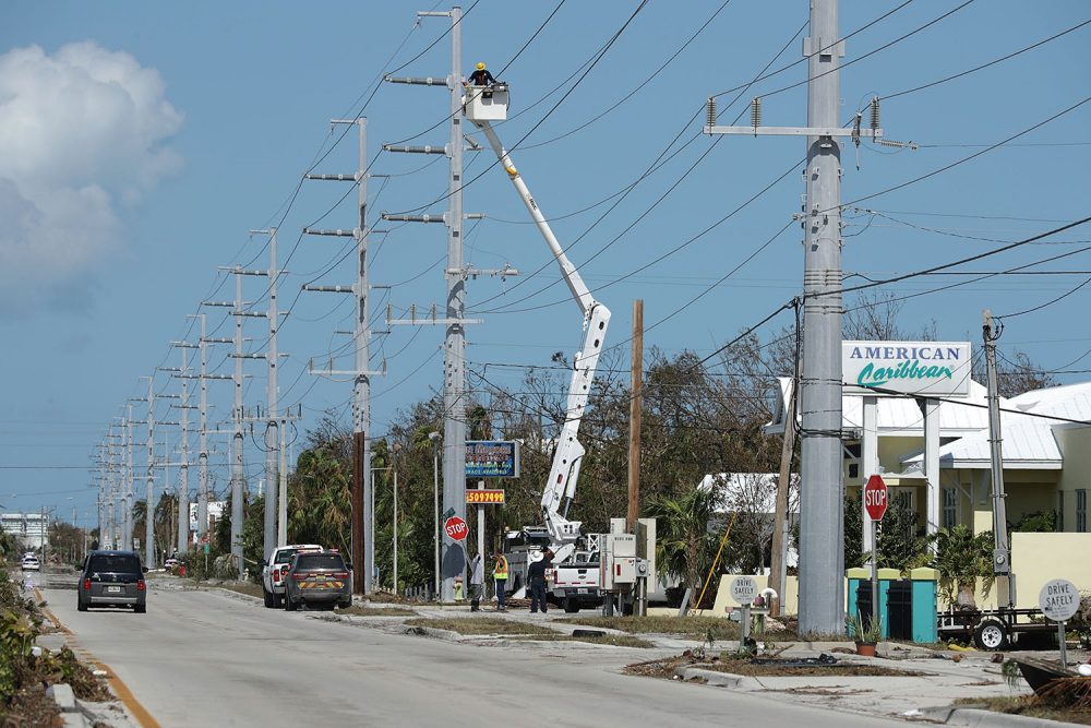 Utility workers repair high-voltage power lines across from the Florida Keys Marathon International Airport Sept. 12, 2017 in Marathon, Fla. (Chip Somodevilla/Getty Images)