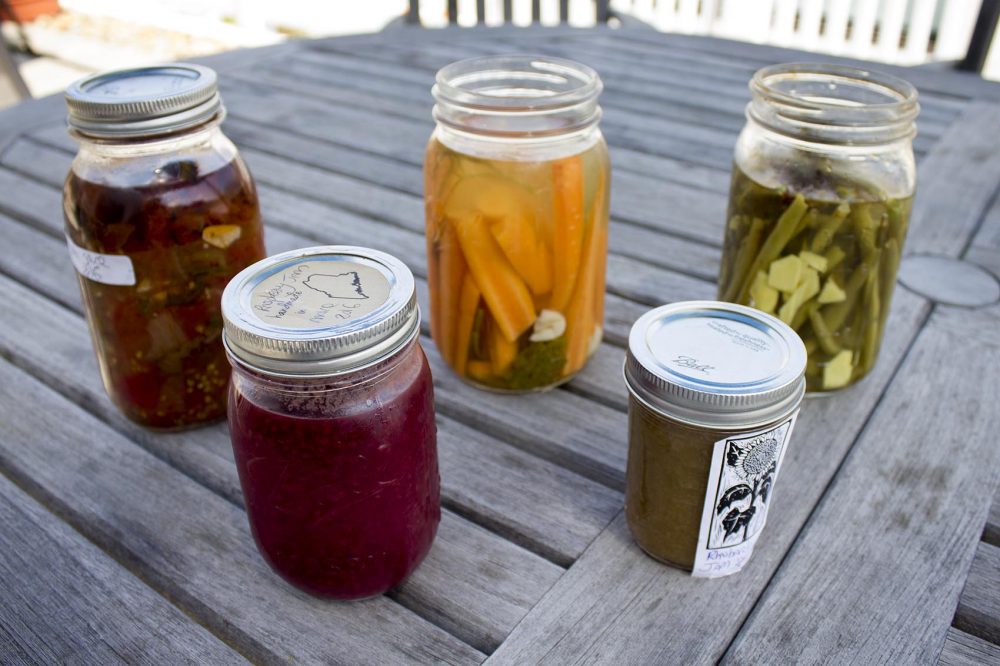 The idea behind canning is to preserve the very freshest, ripest summer foods — be it seasonal fruit, vegetables or edible flowers — before they begin to decay. (Jackson Mitchell/Here & Now)