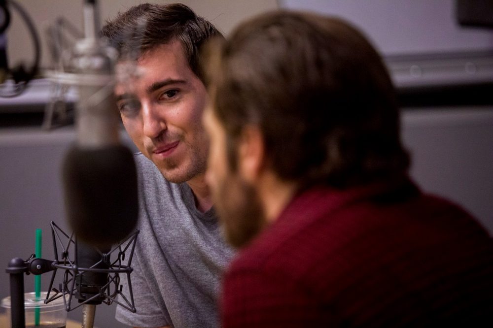 Boston Marathon bombing victim Jeff Bauman looks at Jake Jake Gyllenhaal during an interview on Here &amp; Now. (Jesse Costa/WBUR)