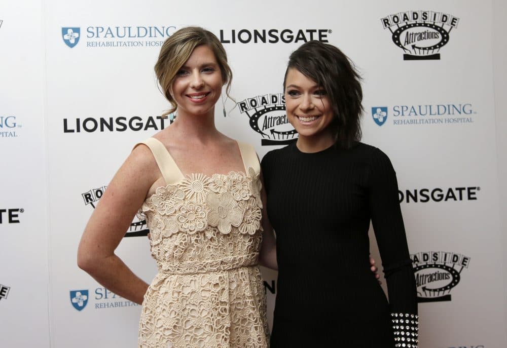 Erin Hurley, left, and actress Tatiana Maslany, right, arrive on the red carpet. (Steven Senne/AP)
