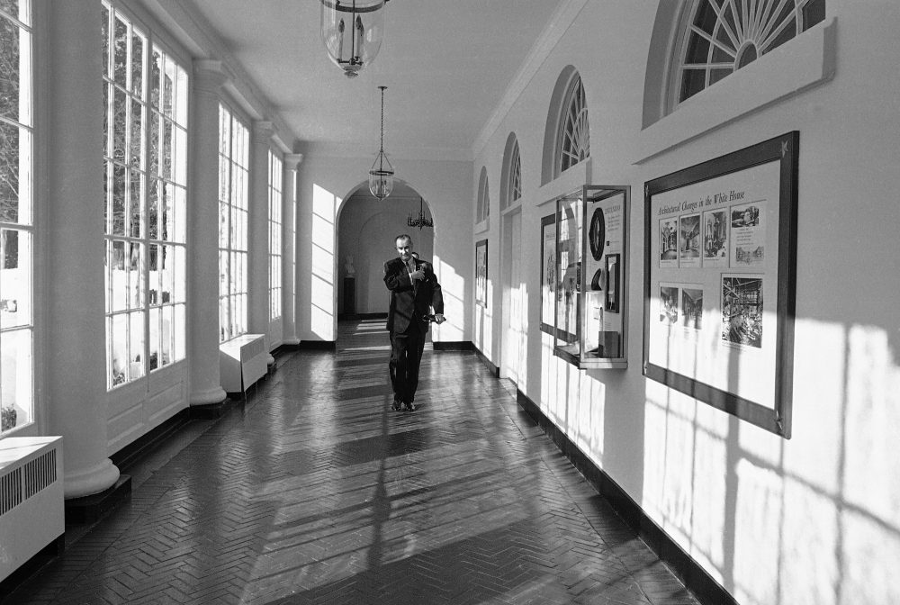 President Lyndon Johnson walks down a White House corridor on his way to tell the nation and the world of the decision to resume bombing of North Vietnam, Jan. 31, 1966. In February 1966, Johnson traveled to Hawaii to meet Vietnamese leaders Nguyen Cao Ky and Nguyen van Thieu. Historians Brian Balogh and Nathan Connolly say it was an attempt to draw attention away from the start of Sen. J. William Fulbright's (D-Ark.) Vietnam hearings, which threatened Johnson's agenda. (AP)