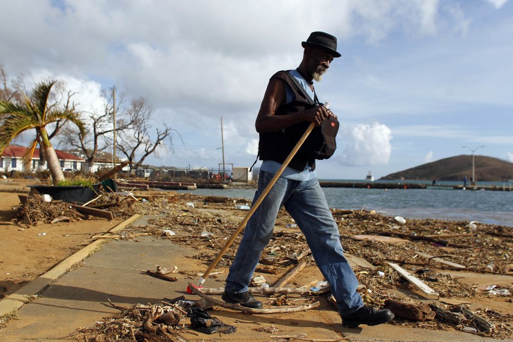 A man walks past debris caused by Hurricane Irma in Charlotte Amalie, St. Thomas, U.S. Virgin Islands, Sunday, Sept. 10, 2017. The storm ravaged such lush resort islands as St. Martin, St. Barts, St. Thomas, Barbuda and Anguilla. (Ricardo Arduengo/AP)