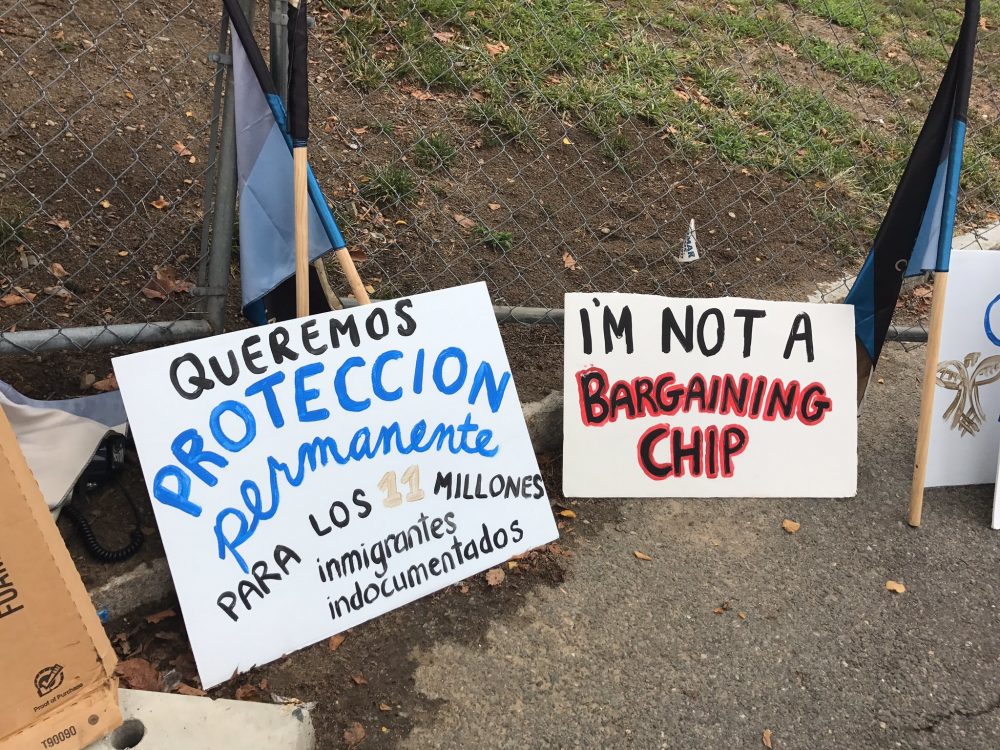 Signs carried by immigrants rights supporters at the protest. (Kassandra Sundt / WBUR)