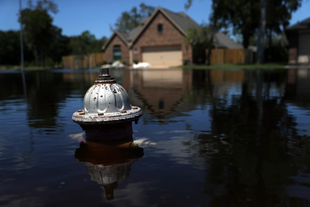 The top of a fire hydrant sticks out of floodwaters in front of a home on Sept. 7, 2017, in Richwood, Texas, in the aftermath of Harvey. (Justin Sullivan/Getty Images)