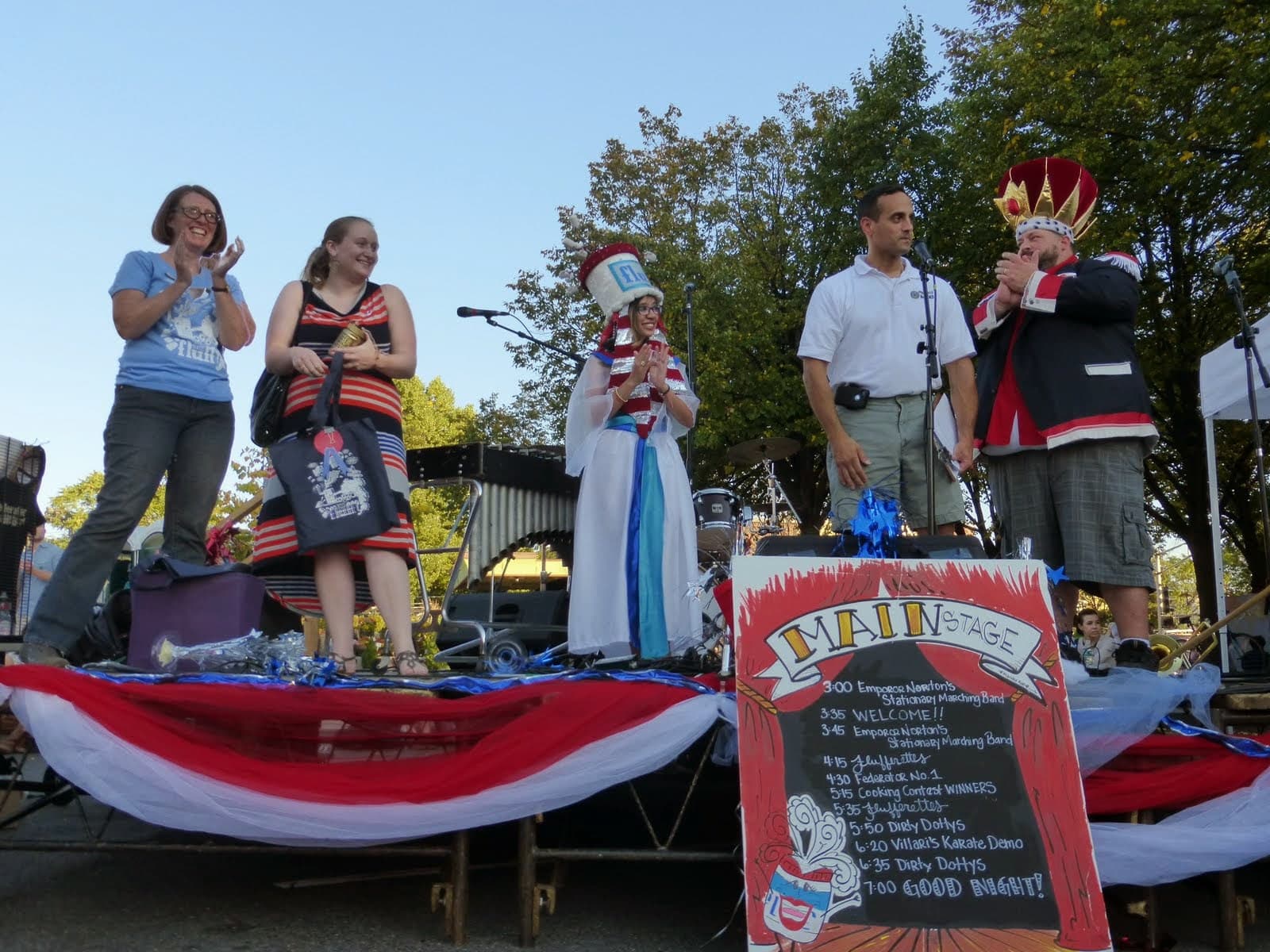 Festival founder Mimi Graney (far left) on stage with Somerville Mayor Joe Curtatone at the 2014 Fluff Festival. (Courtesy Linda Gritz/Union Square Main Streets)