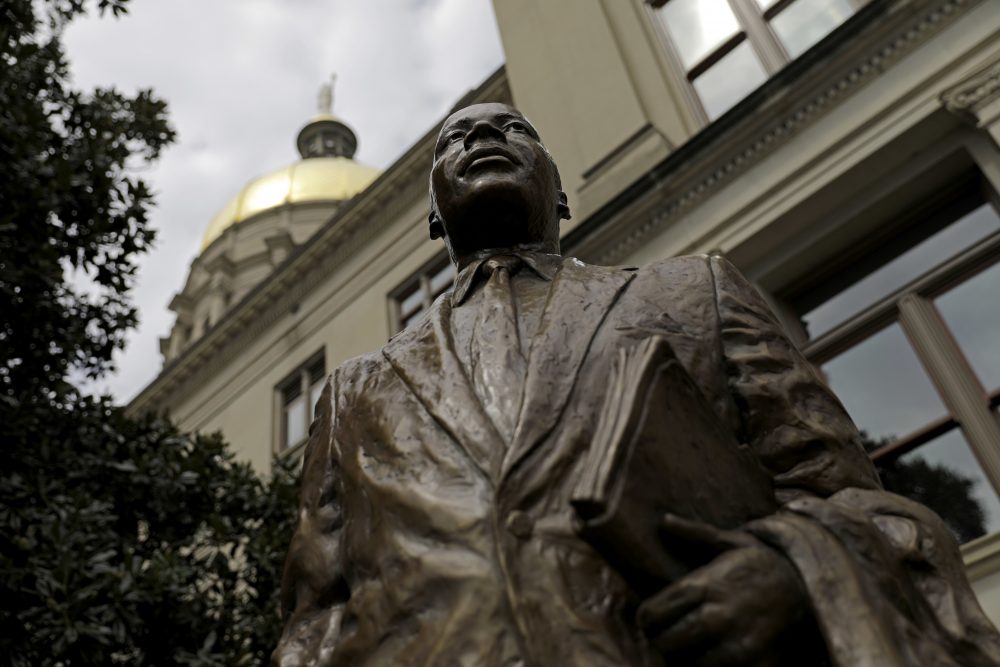 A statue paying tribute to civil rights leader Martin Luther King Jr. is unveiled on the state Capitol grounds in Atlanta on Aug. 28. It was unveiled on the 54th anniversary of King's &quot;I have a dream&quot; speech. (David Goldman/AP)