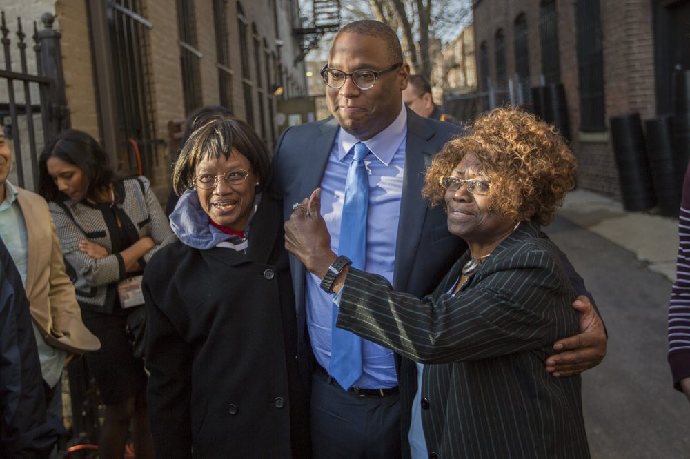 City Councilor Tito Jackson poses for a photo with his mother, Rosa (right), and Ardelia Hinton after announcing his mayoral candidacy in Dudley Square. (Jesse Costa/WBUR)