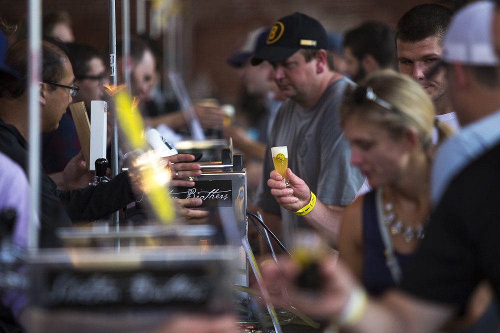 Festival goers lined up to sample beer from over 50 brewers from around the world. (Jesse Costa/WBUR)
