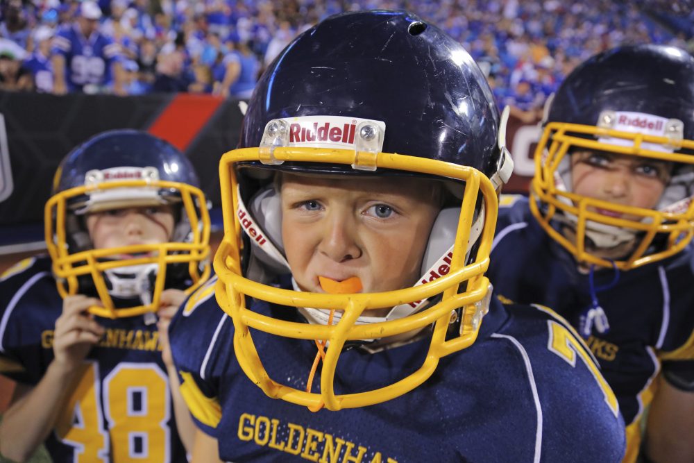 Youth football players in a Aug. 14, 2015, file photo (Bill Wippert/AP)