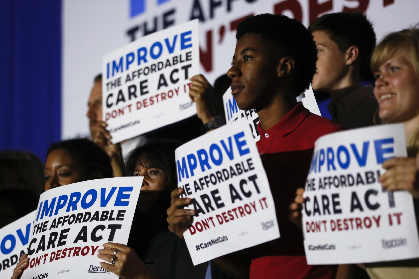 Supporters of Sen. Bernie Sanders, I-Vt., listen as he speaks during a "Care Not Cuts" rally in support of the Affordable Care Act, Sunday, July 9, 2017, in Covington, Ky. (John Minchillo/AP)