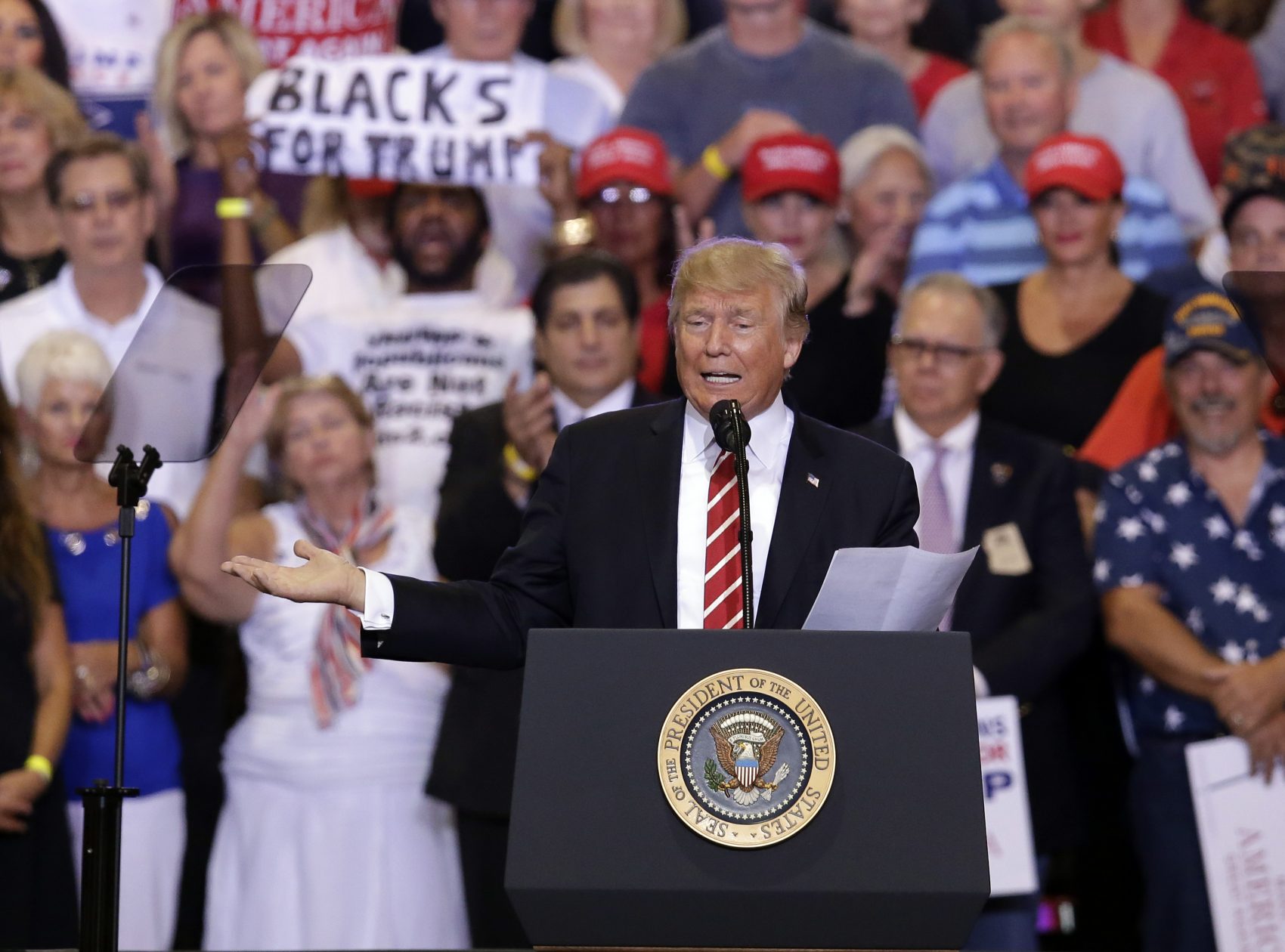 President Donald Trump gestures to the crowd while speaking at a rally at the Phoenix Convention Center, Tuesday, Aug. 22, 2017, in Phoenix. (Rick Scuteri/AP)
