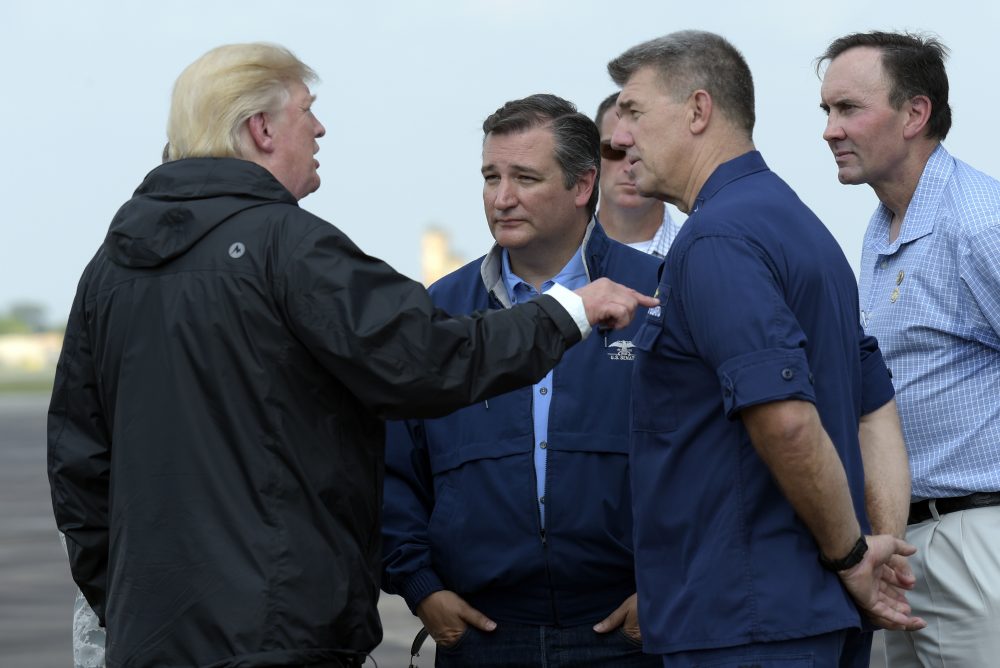 President Donald Trump talks with Sen. Ted Cruz, R-Texas, and others before boarding Air Force One at Ellington Field after meeting people impacted by Hurricane Harvey during a visit to Houston, Saturday, Sept. 2, 2017. (Susan Walsh/AP)