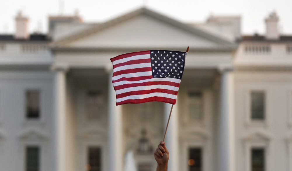 A supporter of the Deferred Action for Childhood Arrivals, or DACA, waves a flag during a rally outside the White House, in Washington, Monday, Sept. 4, 2017. A plan President Donald Trump is expected to announce Tuesday for young immigrants brought to the country illegally as children was embraced by some top Republicans on Monday and denounced by others as the beginning of a &quot;civil war&quot; within the party. (AP Photo/Carolyn Kaster)
