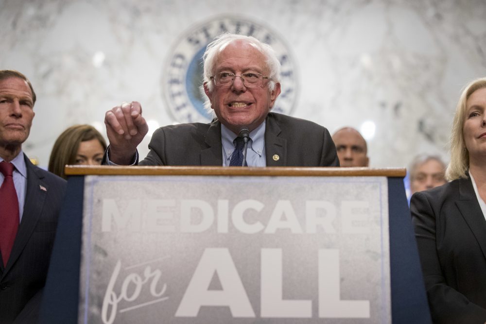 Sen. Bernie Sanders, I-Vt., center, accompanied by Sen. Richard Blumenthal, D-Conn., left, and Sen. Kirsten Gillibrand, D-N.Y., right, speaks at a news conference on Capitol Hill in Washington, Wednesday, Sept. 13, 2017, to unveil their Medicare for All legislation to reform health care. (Andrew Harnik/AP)
